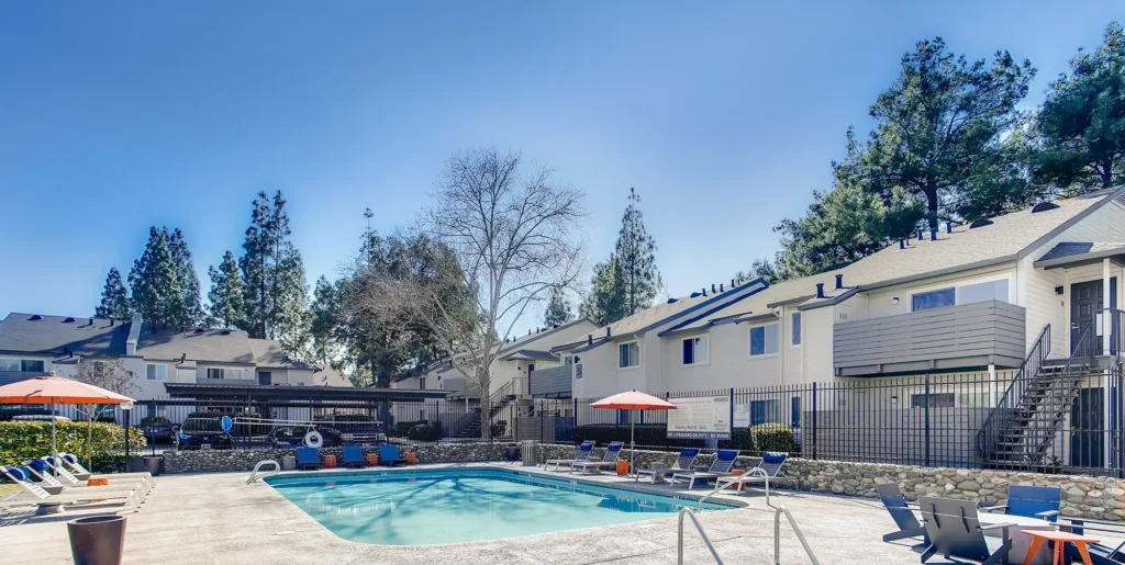 Pool with deck seating and spa