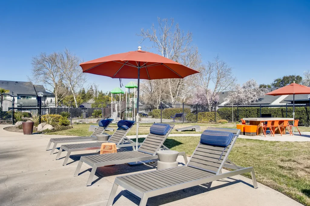 Pool with deck seating and spa